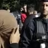 Police officer and woman wearing niqab - national security